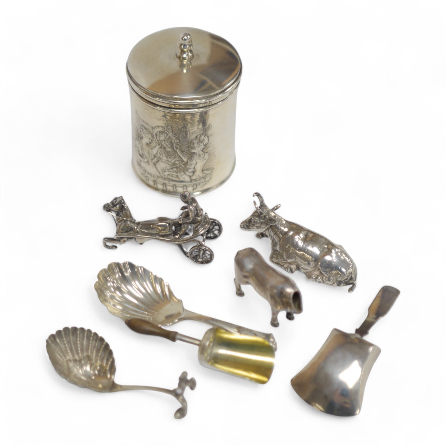 A collection of small silver including an Edwardian cylindrical pot and cover, 84mm, four 19th century caddy spoons including George IV, John Thropp, Birmingham, 1828, a small continental box modelled as a recumbent bull